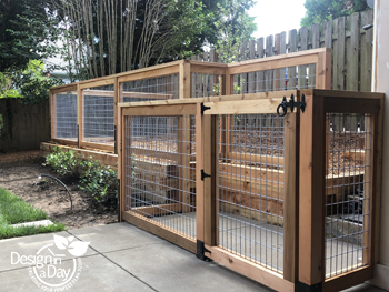 Fencing provides potty area for dogs that separate from the garden protecting plants from dogs