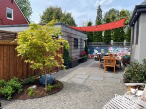 landscape hardscaping is poured concrete, modern pavers and crushed rock work great for this outdoor living area in NE Portland.