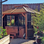 The gazebo nestled into the boulder walls to create it's own private hot tub room.