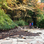 client during installation of flagstone